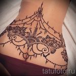 lace tattoo on the lower back 2