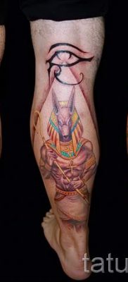 Anubis tattoo on his leg — the tattoo picture for an article about the importance of 2