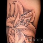 lily tattoo on her arm - a tattoo of the photo example 13072016 1