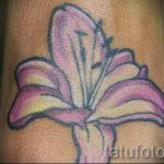 lily tattoo on her arm - a tattoo of the photo example 13072016 2