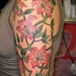 lily tattoo on her arm - a tattoo of the photo example 13072016 3