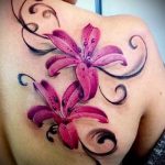 lily tattoo on her back - Photo example of the tattoo 13072016 2