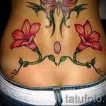 lily tattoo on the lower back - Photo example of the tattoo 13072016 3