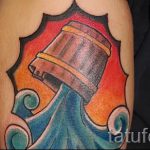 Aquarius tatouage sur son bras - photo - un exemple du tatouage fini 01082016 1017 tatufoto.ru