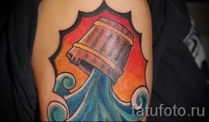 Aquarius tatouage sur son bras - photo - un exemple du tatouage fini 01082016 1017 tatufoto.ru