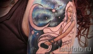Aquarius tattoo on his arm - photo - an example of the finished tattoo 01082016 2027 tatufoto.ru