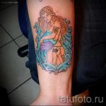 Aquarius tattoo on his forearm - photo - an example of the finished tattoo 01082016 3030 tatufoto.ru