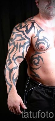Foto — Tribal Tattoo auf seinem Arm — ein Beispiel für einen Artikel über die Bedeutung der 1009 tatufoto.ru