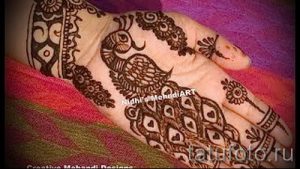 mehendi auf einer Hand Vogelfeder - Foto temporäre Henna-Tattoo 2053 tatufoto.ru