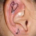 notes tattoo in the ear - a photo of the finished tattoo on 02082016 2014 tatufoto.ru