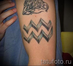 tattoo in the form of Aquarius - photo - an example of the finished tattoo 01082016 1049 tatufoto.ru