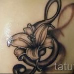 тату ноты в цветах - фото готовой татуировки от 02082016 1085 tatufoto.ru