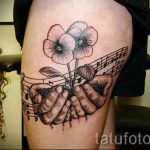 тату ноты в цветах - фото готовой татуировки от 02082016 4088 tatufoto.ru