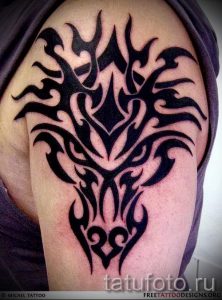 фото - тату трайбл дракон - пример для статьи про значение 2044 tatufoto.ru