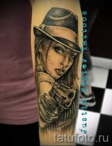 Tattoo-Mädchen mit einer Pistole - ein Foto des fertigen Tätowierung 01092016 1051 tatufoto.ru