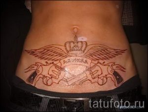 pistols tattoo on his stomach - a photo of the finished tattoo 01092016 2029 tatufoto.ru