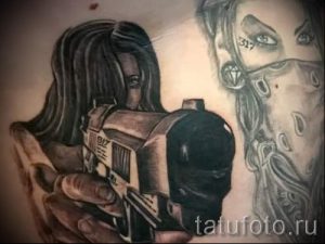 tattoo girl with a gun - a photo of the finished tattoo 01092016 1039 tatufoto.ru