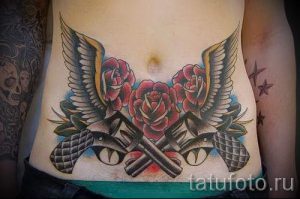 тату пистолеты на животе - фото готовой татуировки 01092016 12198 tatufoto.ru