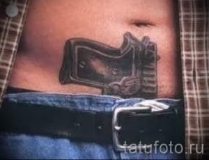 тату пистолеты на животе - фото готовой татуировки 01092016 14200 tatufoto.ru