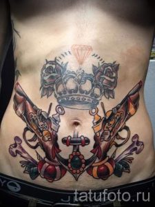 тату пистолеты на животе - фото готовой татуировки 01092016 8194 tatufoto.ru
