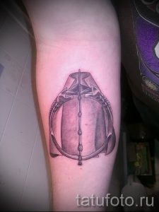 Фото тату тату дары смерти для статьи про значение рисунка татуировки - tatufoto.ru - 70