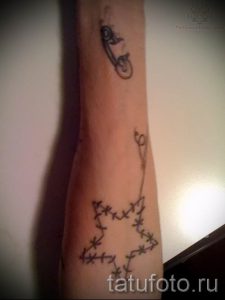 тату булавка фото для статьи про значение татуировки с булавкой - tatufoto.ru - 12