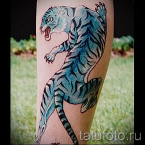 фото тату оскал тигра для статьи про значение татуировки с оскалом - tatufoto.ru - 8
