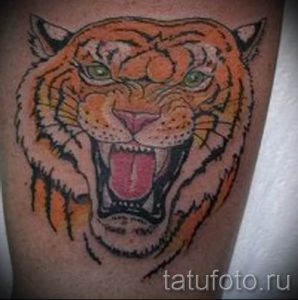 фото тату оскал тигра для статьи про значение татуировки с оскалом - tatufoto.ru - 25