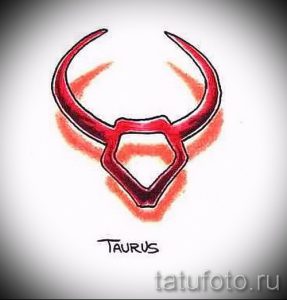 Фото минималистичной татуировки с изображением символа зодиака Телец. Красные линии и брызги краски создают яркий и запоминающийся образ.
