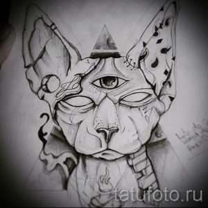 Эскиз татуировки с изображением головы сфинкса с третьим глазом на лбу. Графический стиль, черно-белый рисунок.