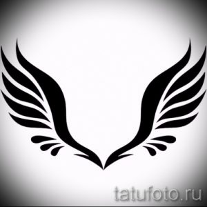 Черно-белый эскиз татуировки с изображением двух крыльев. Минималистичный дизайн для любителей лаконичных татуировок.