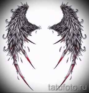 Фото эскиза татуировки: пара черных крыльев с красными брызгами, имитирующими кровь. Для любителей готики.