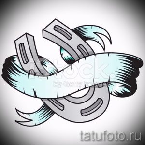Фото тату подковы в стиле графика. Четкие контуры и детализированный рисунок. Идеально для тех, кто верит в силу талисманов.