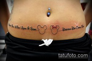 Фото тату на животе с надписью "When You Wish Upon A Star... Dreams Do Come True" и силуэтами Микки и Минни Маус.
