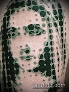 Фото тату: абстрактная татуировка на руке, выполненная в технике pointillism (пуантилизм). Использованы оттенки зеленого и черного.