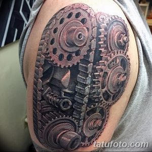 Фото тату биомеханики на предплечье. Реалистичный рисунок шестеренок и механических деталей, создающих эффект открытого механизма под кожей.