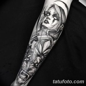 Striking blackwork tattoo featuring a woman's face blended with a wolf's head, using geometric shapes and bold lines for a modern look.