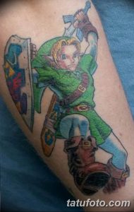 Colorful tattoo of Link from The Legend of Zelda on a forearm, holding a sword and shield, with a dynamic pose and vibrant colors.