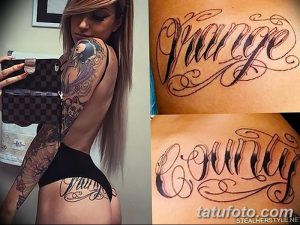 Фото татуировки с именем 'Gauge', выполненной каллиграфическим шрифтом на руке и бедре девушки, с детальной прорисовкой завитушек.