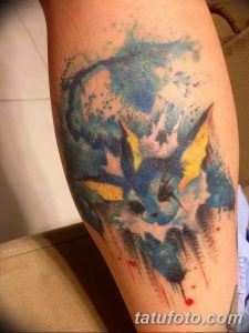 Фото тату Вериона из Pokemon, выполненного в акварельном стиле. Мягкие переходы цветов, размытые контуры и динамичное изображение.