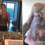 Фотография Джастина Бибера, демонстрирующая его татуировки на груди, животе, руках и спине. Видны сложные рисунки, включая ангелов, животных и надписи.