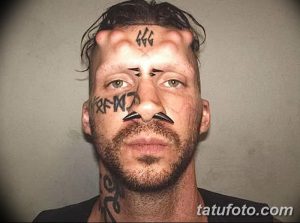 Фото экстремальной татуировки на лице: число 666 на лбу и другие модификации тела. Провокационный и шокирующий рисунок татуировки.