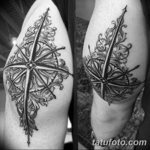 Фото тату на руке: Компас в окружении растительного орнамента, выполненный в черном цвете. Детализированный рисунок в стиле графика.