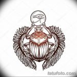 Цветное фото тату с изображением египетского скарабея с крыльями и глазом Гора. Детализированный рисунок для поклонников древней культуры.