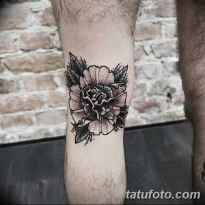 Фото тату розы на предплечье в стиле blackwork. Детализированный рисунок с использованием только черного цвета и различных техник затенения.