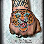фото татуировка оскал тигра от 01.06.2018 №080 - tiger tattoo - tatufoto.com