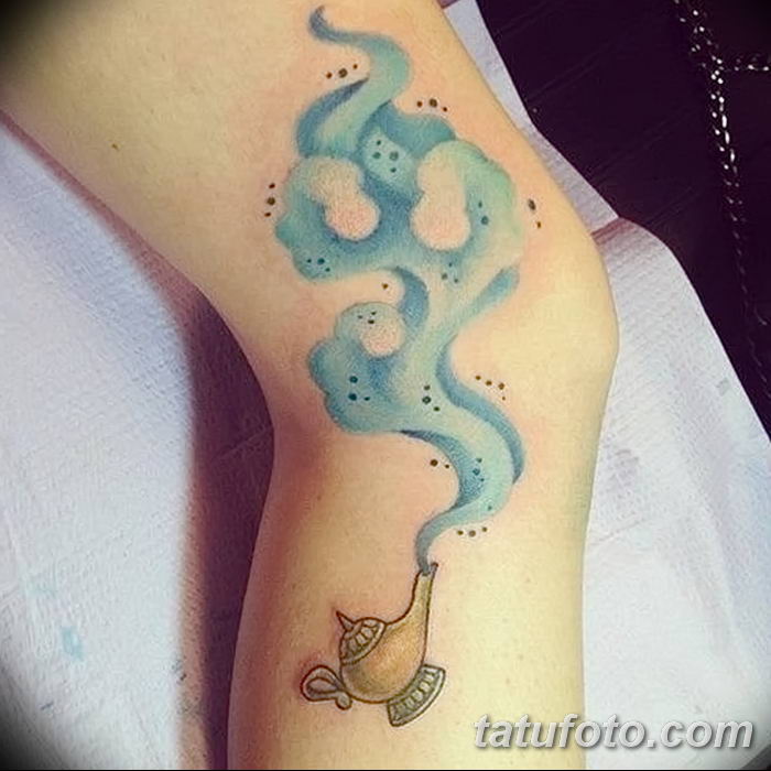 Aladdins genie lamp tattoo on the left arm