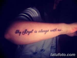 Фото татуировки на предплечье с надписью 'My Angel is always with me...'. Изящный шрифт, выполненный черными чернилами.