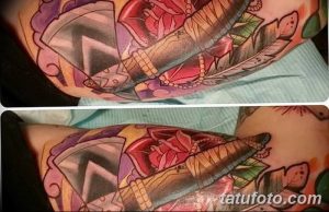 Татуировка томагавка с розами, бисером и перьями в ярких цветах на руке. Детализированная проработка, женственный стиль.