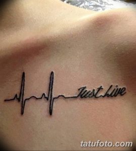 Фото тату с изображением кардиограммы и надписью 'Just live' на груди. Тонкие линии, лаконичный дизайн. Символизирует жизнь и энергию.